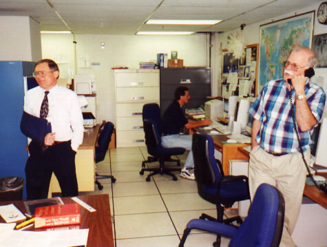 WPC/MPC Director Jim Hoke looks on as WPC Erich Wolf informs SMCC that AFOS will be removed from service